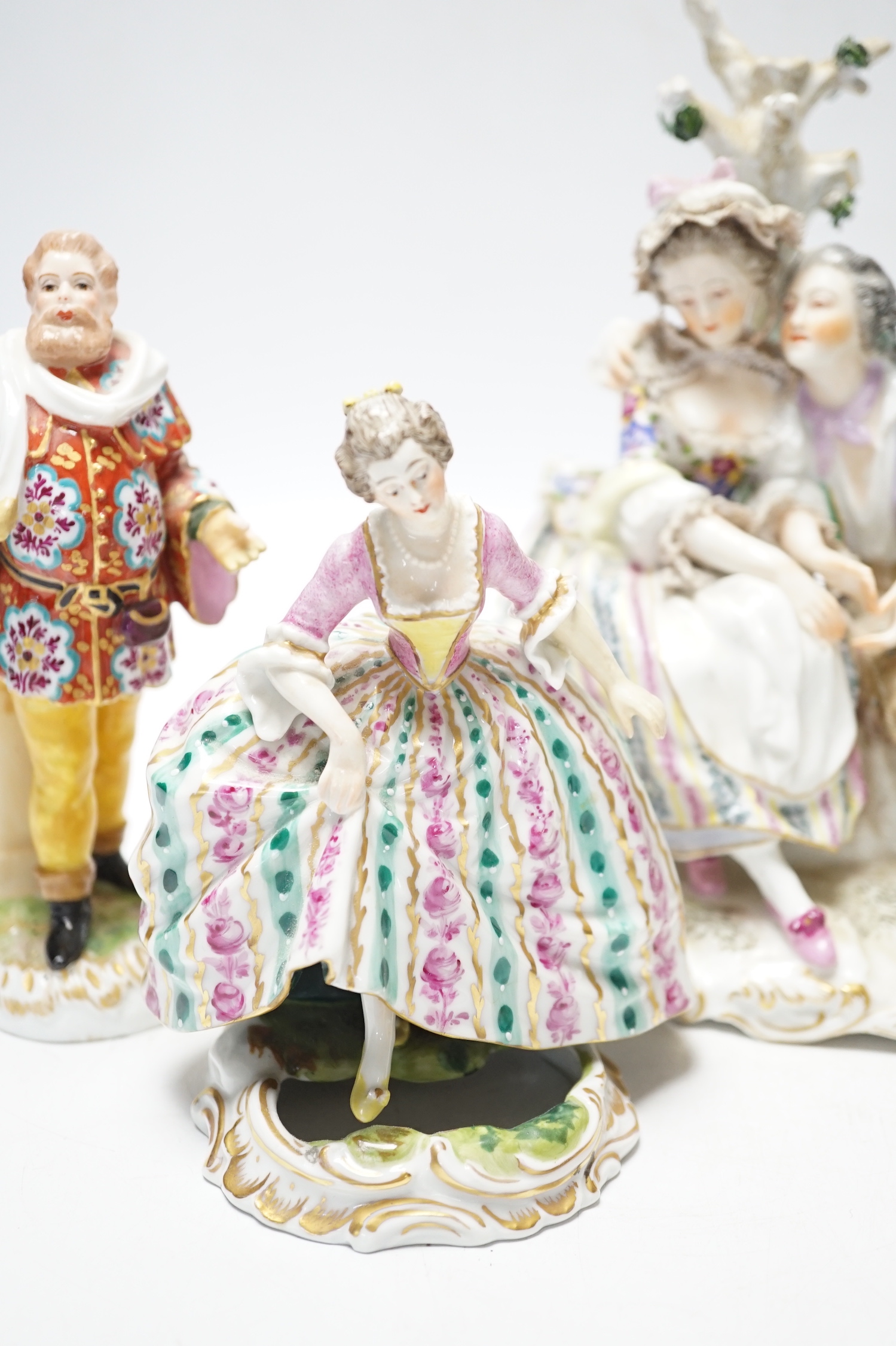 Four Continental porcelain figures or groups, tallest 19cm